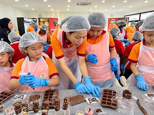 GELM ChildrenCare treats underprivileged children to a chocolate making workshop